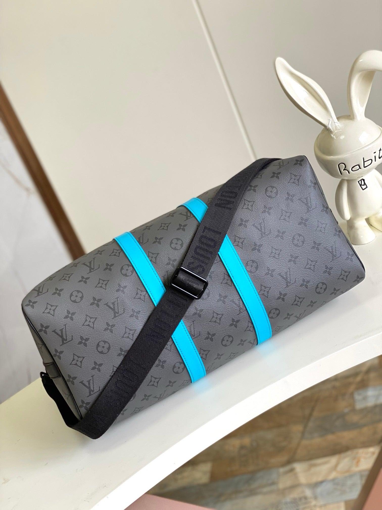 Louis Vuitton Keepall Bandoulière in Monogram Eclipse with Turquoise Accents - Authentic & Brand New Exclusive Apparel