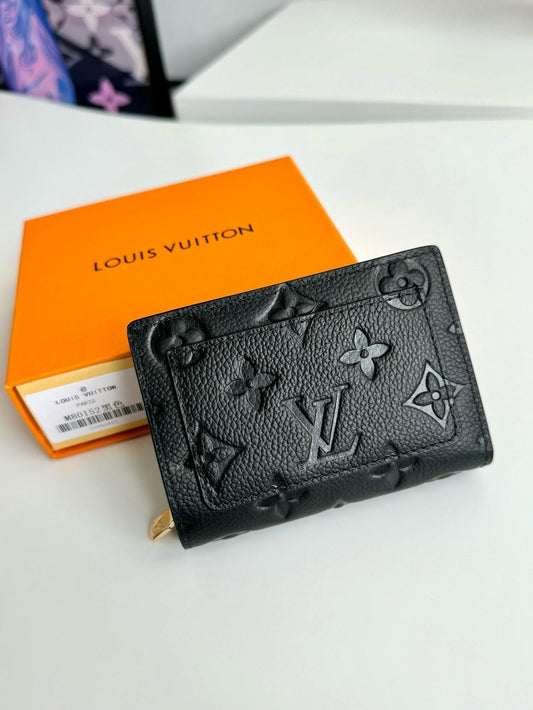 Authentic Louis Vuitton Monogram Empreinte Leather Card Holder in Black Exclusive Apparel